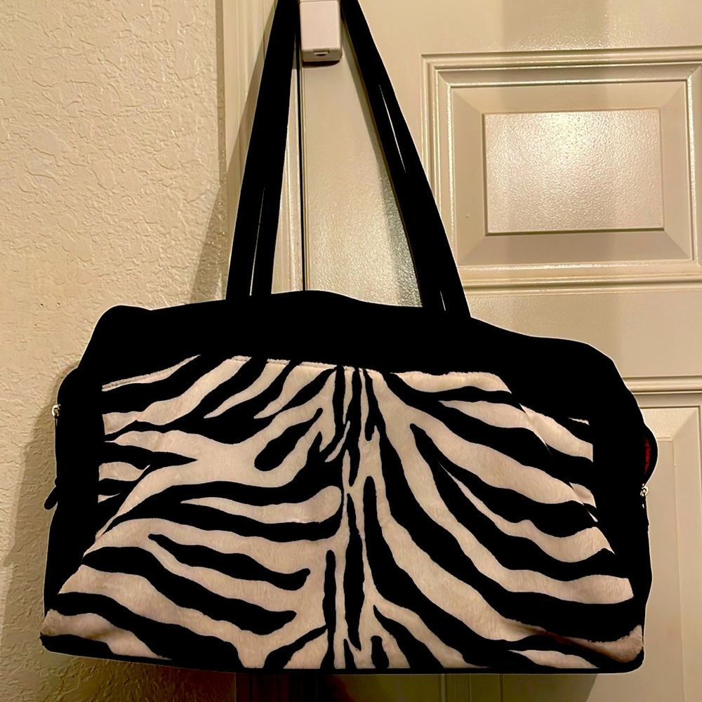 Lancôme Beauty zebra animal print weekender Bag.
